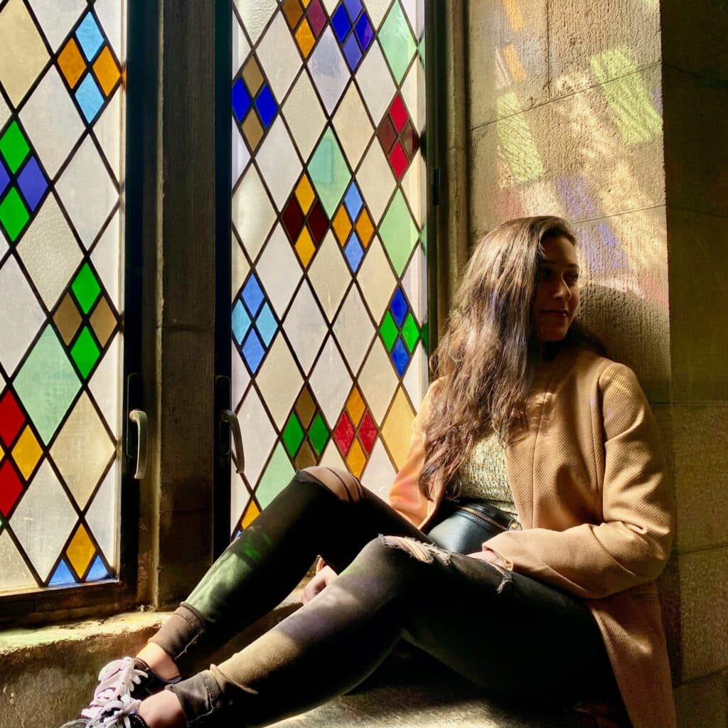Julianne Smithsitting by a colorful window