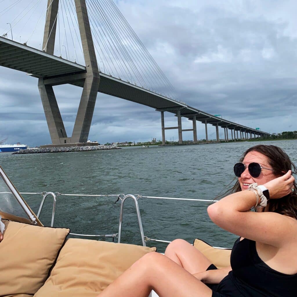 Jamie Lief on boat passing a bridge