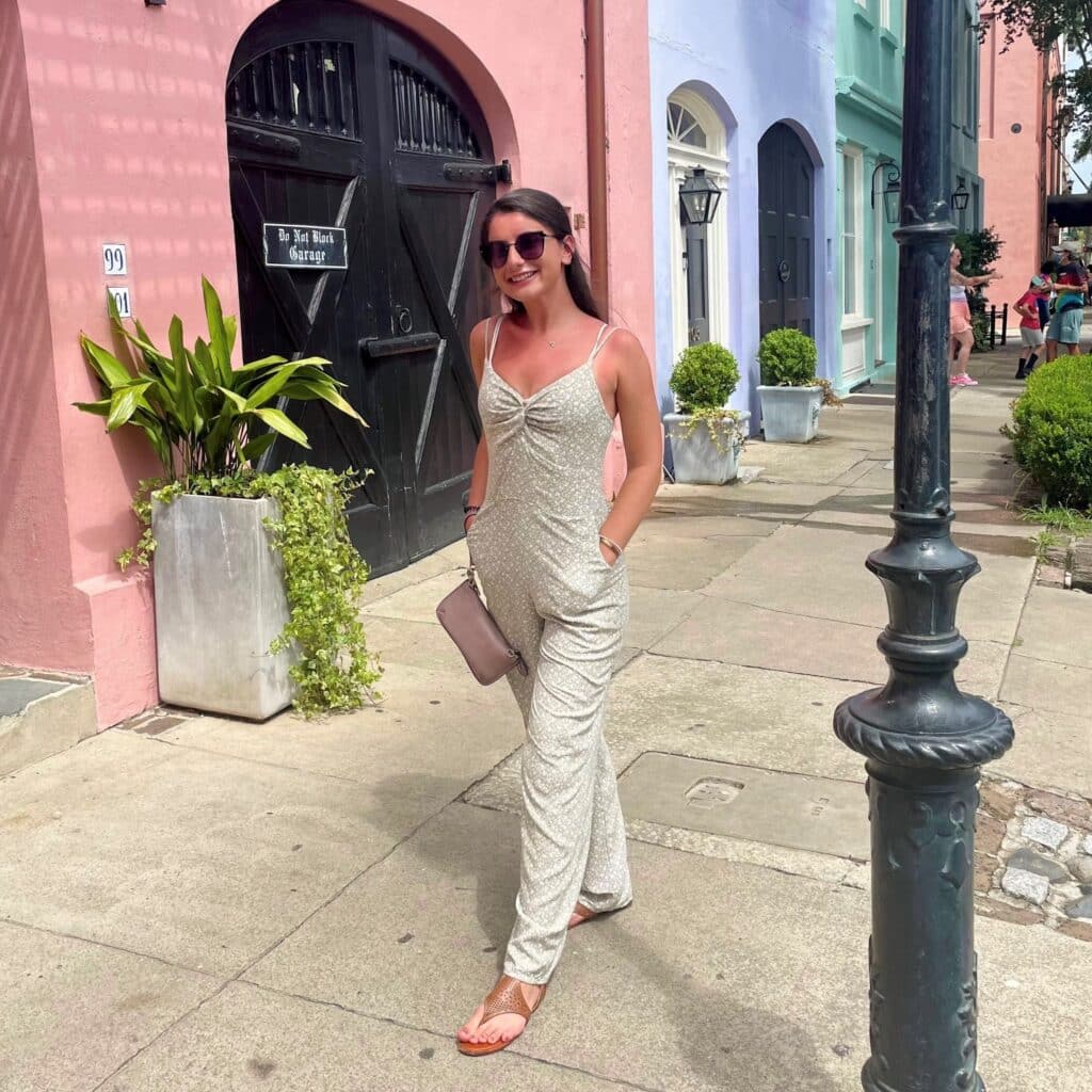 Nicole Pia travel portrait in front of colorful buildings