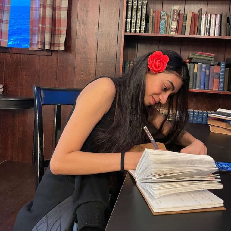 Riya Shah writing scaled