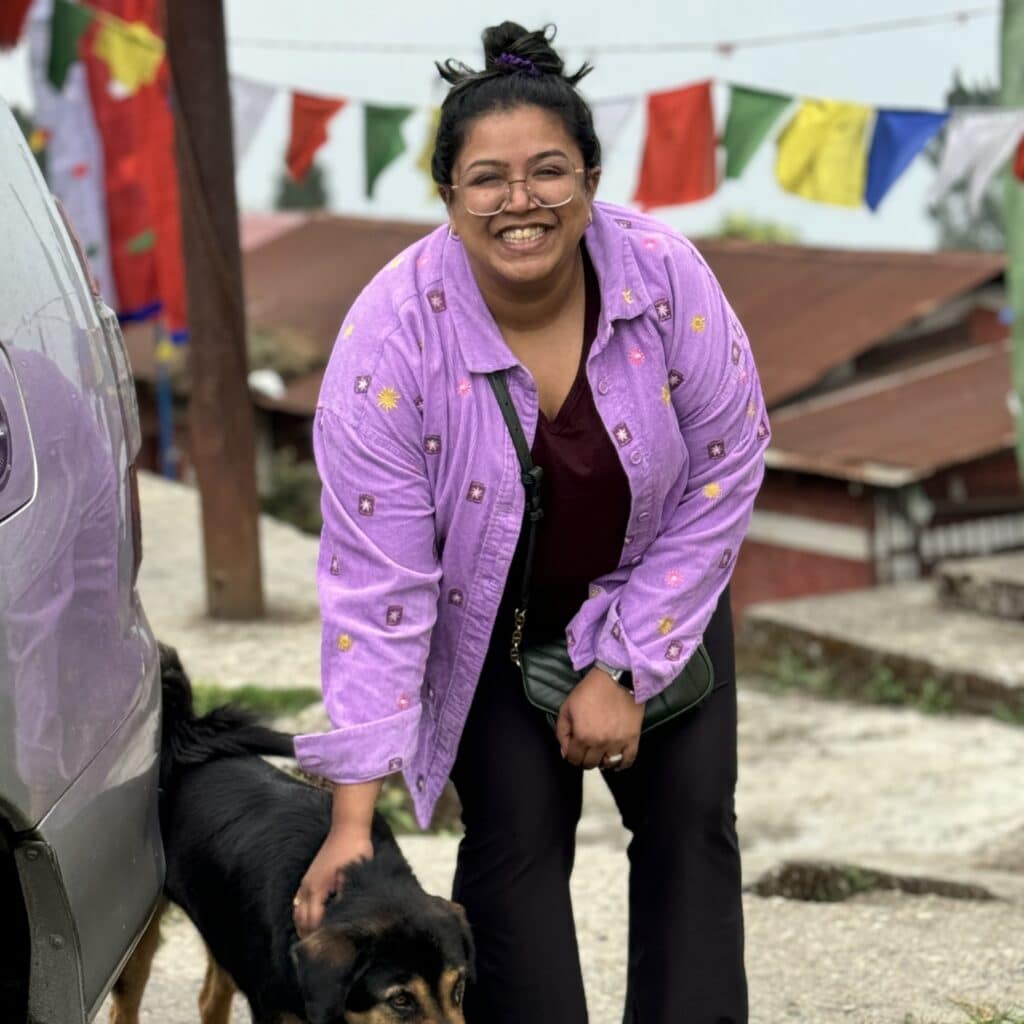 Anvitha Shivakumar petting a dog
