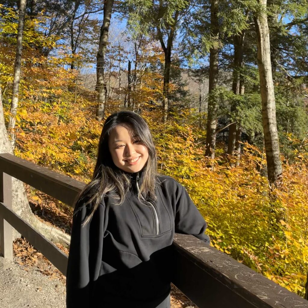 Ella Hu hiking in a forest